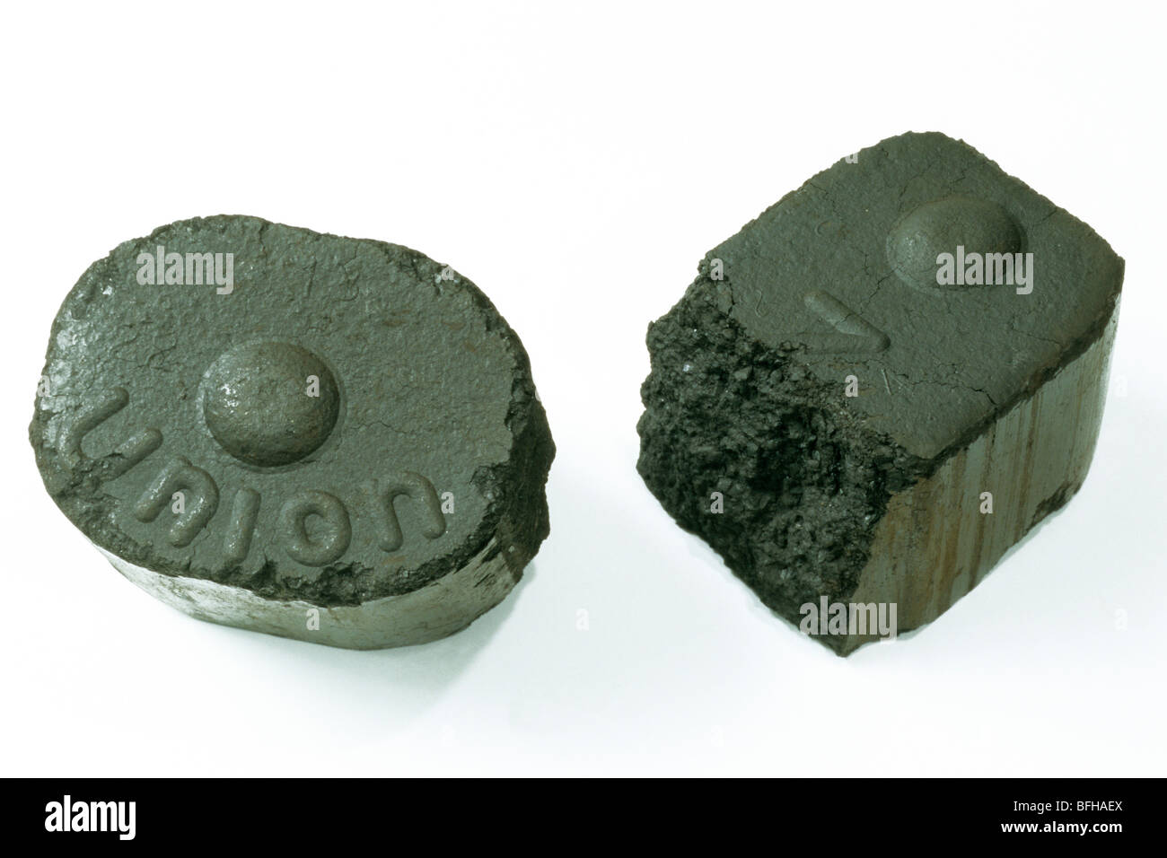Brown coal or lignite, two bricketts, studio picture. Stock Photo