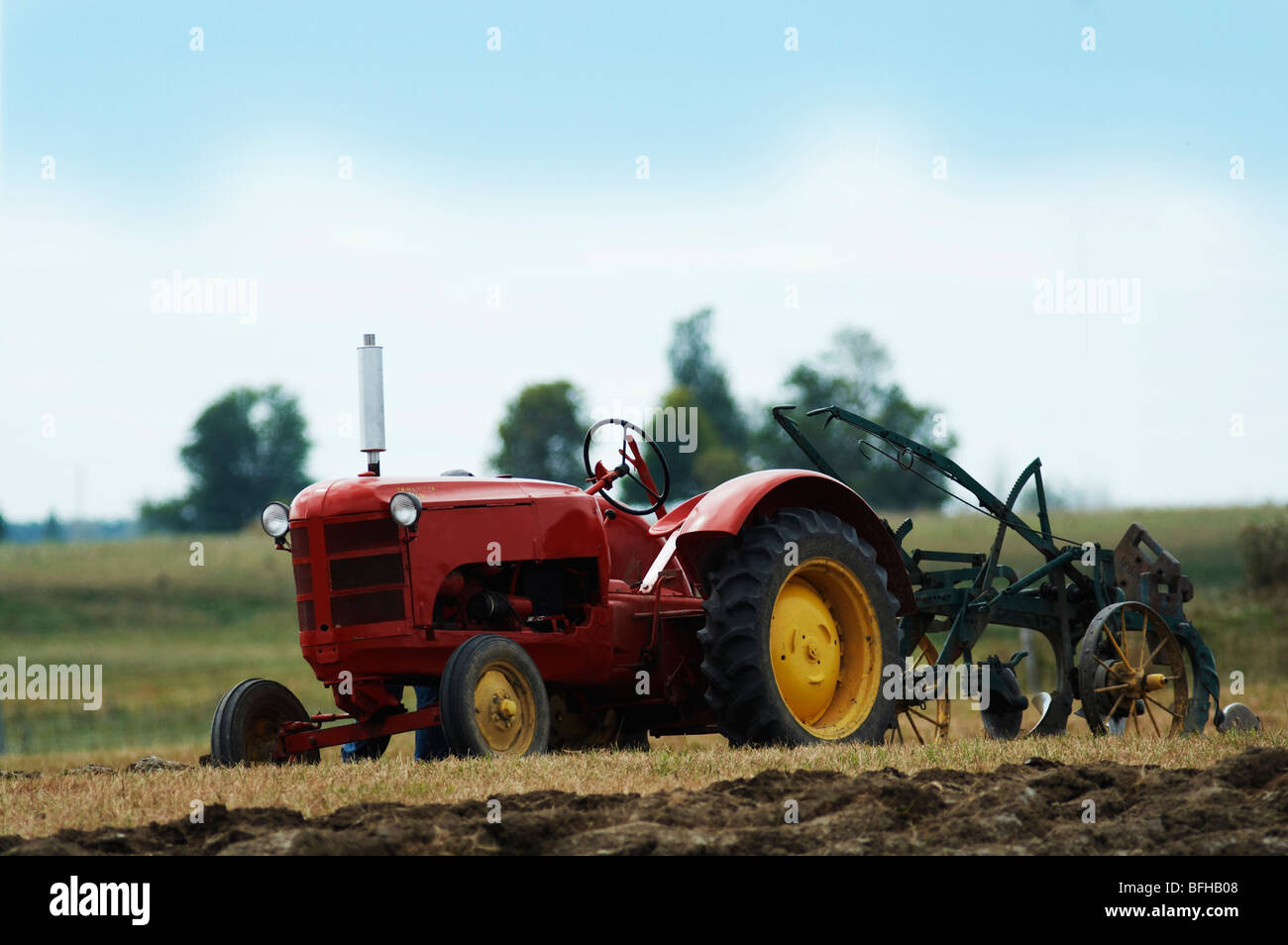 A tractor sits in a field Stock Photo - Alamy