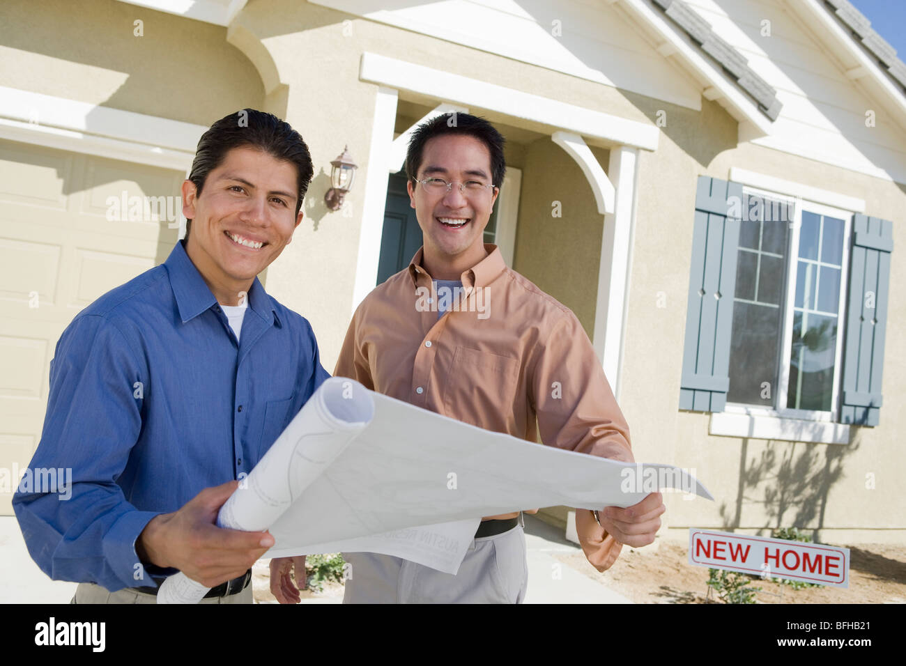 Architect showing house plans Stock Photo - Alamy