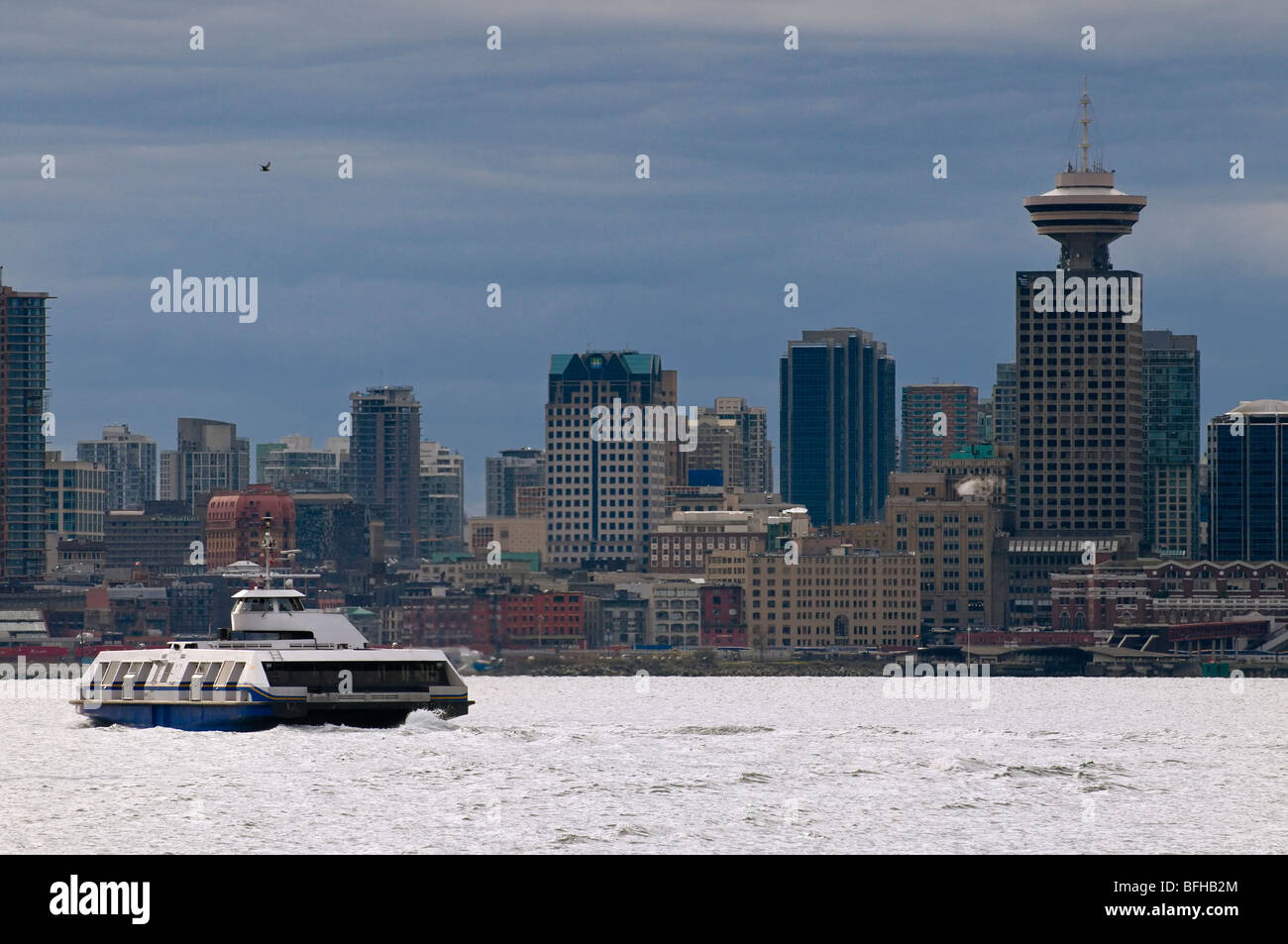 A Seabus crosses the Vancouver harbour towards downtown Vancouver. Stock Photo
