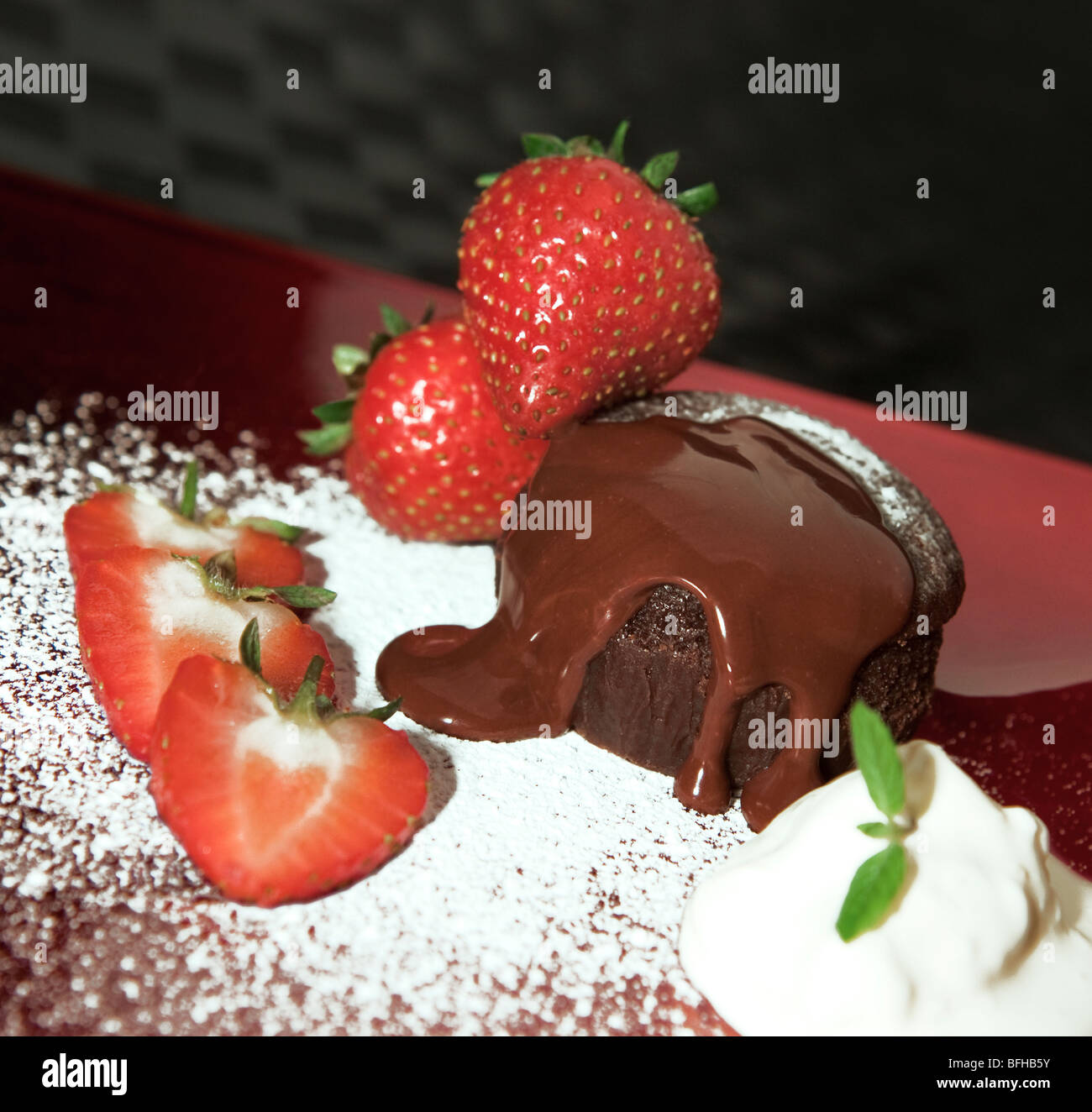 Chocolate cake with strawberries, Chocolate sauce & Cream Stock Photo ...