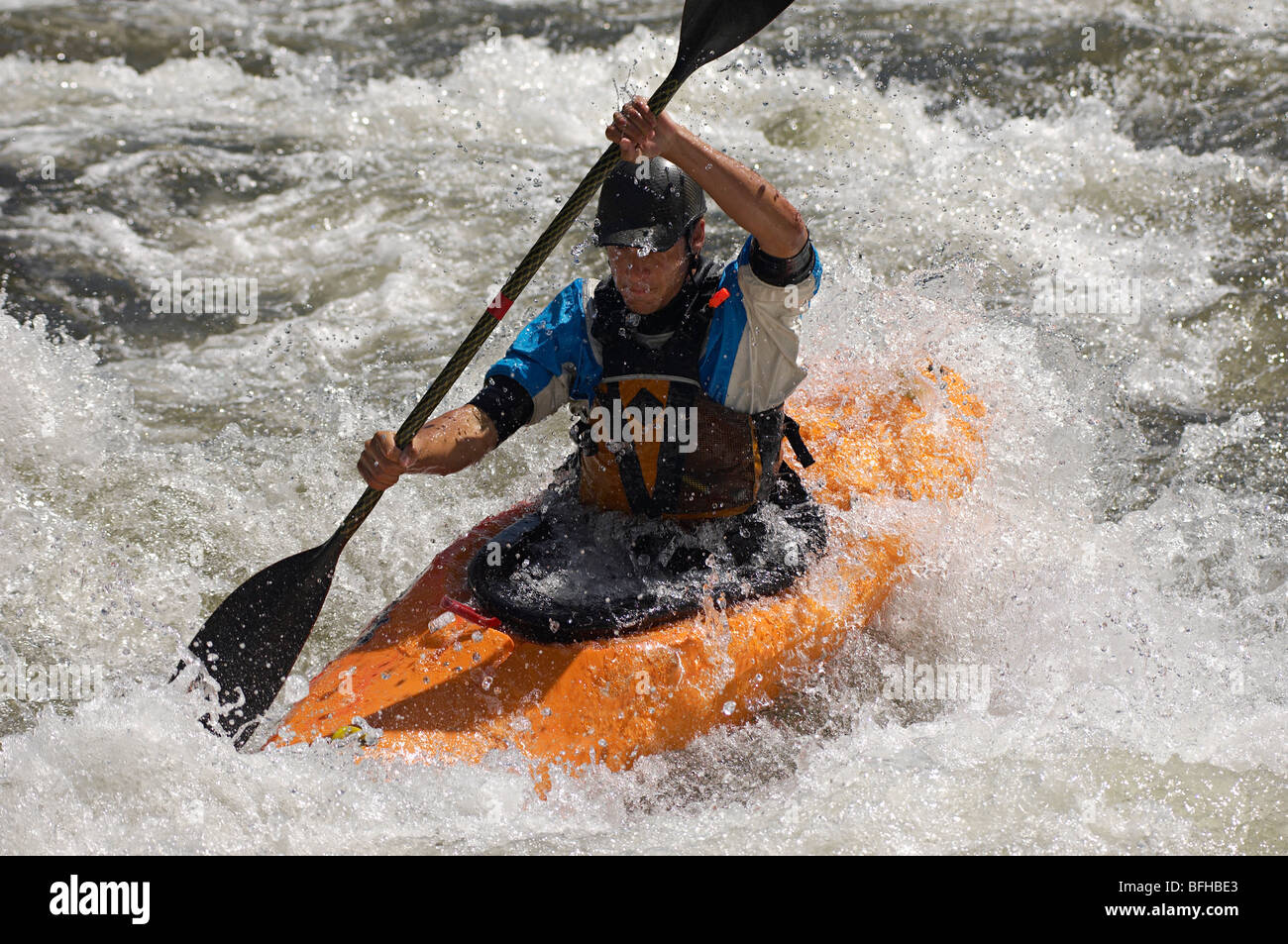 Man kayaking on mountain river Stock Photo
