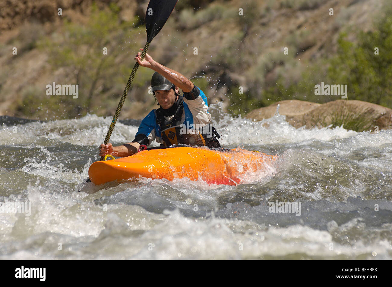 Man kayaking on mountain river Stock Photo