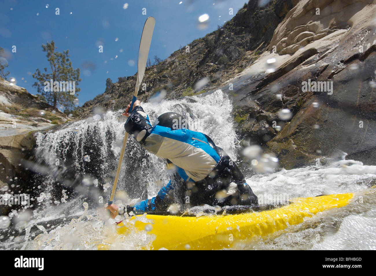 Man kayaking in mountain river Stock Photo