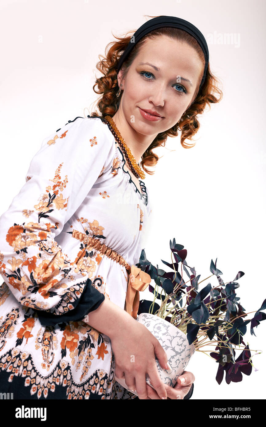 Young woman holding a plant Stock Photo - Alamy