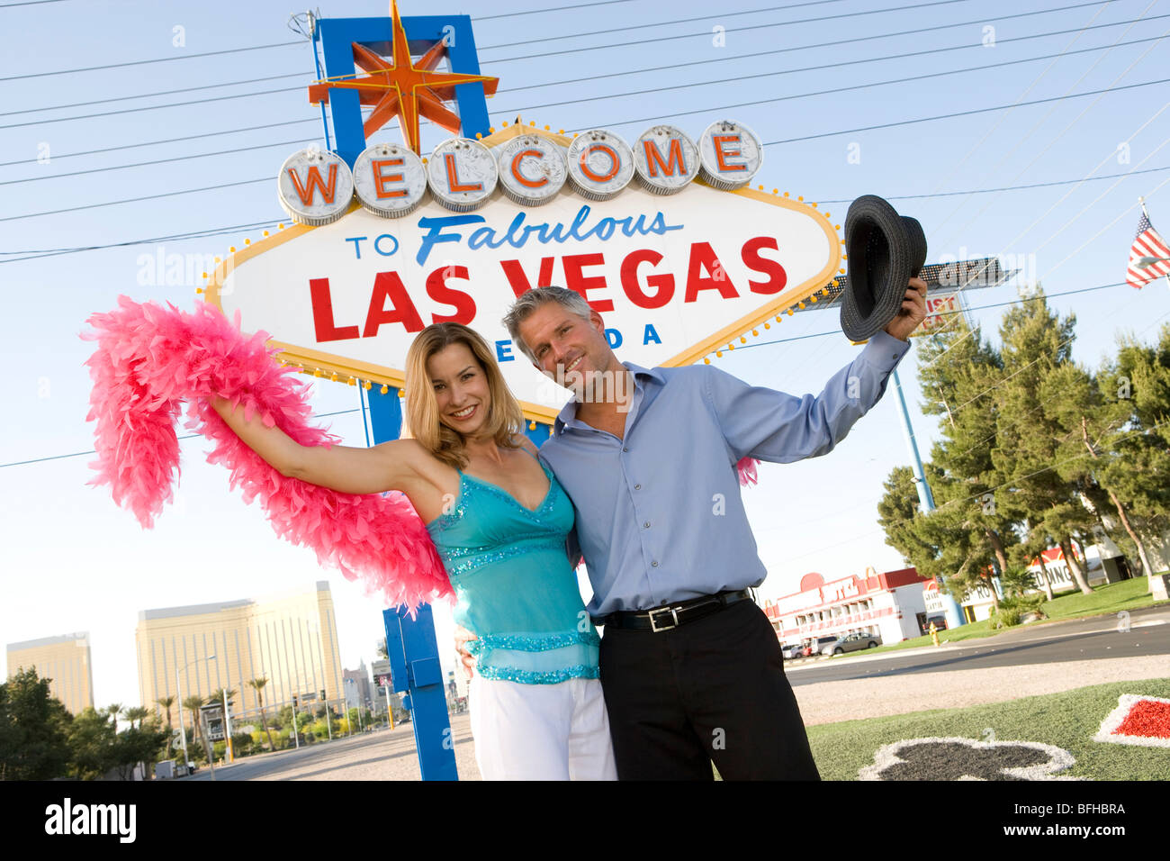 Mid-adult couple in front of Welcome to Las Vegas sign, portrait Stock Photo