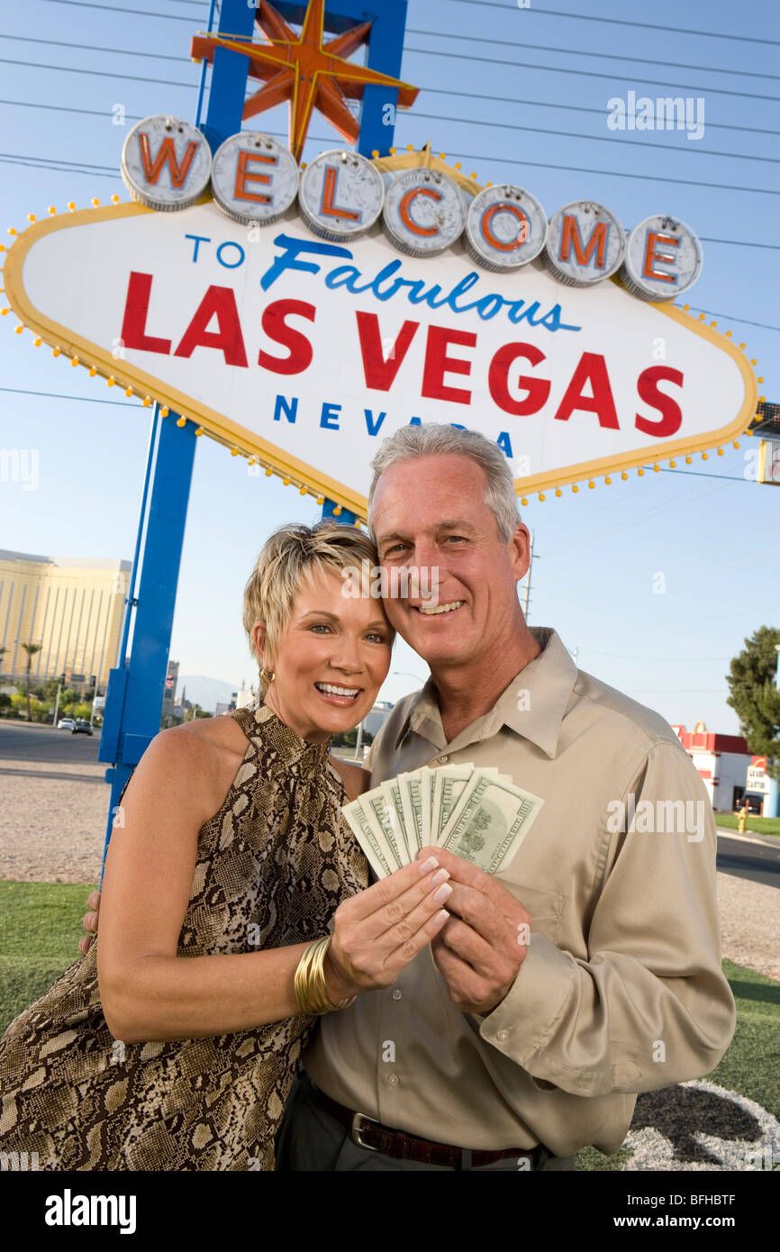 Middle-aged couple in front of Welcome to Las Vegas sign, portrait Stock Photo