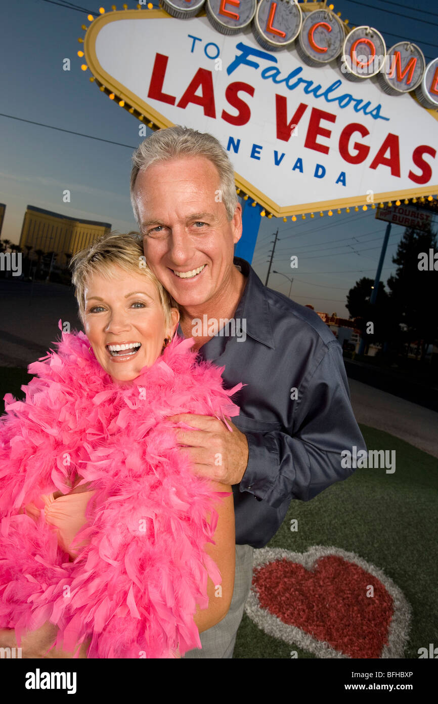 Middle-aged couple in front of Welcome to Las Vegas sign, portrait Stock Photo