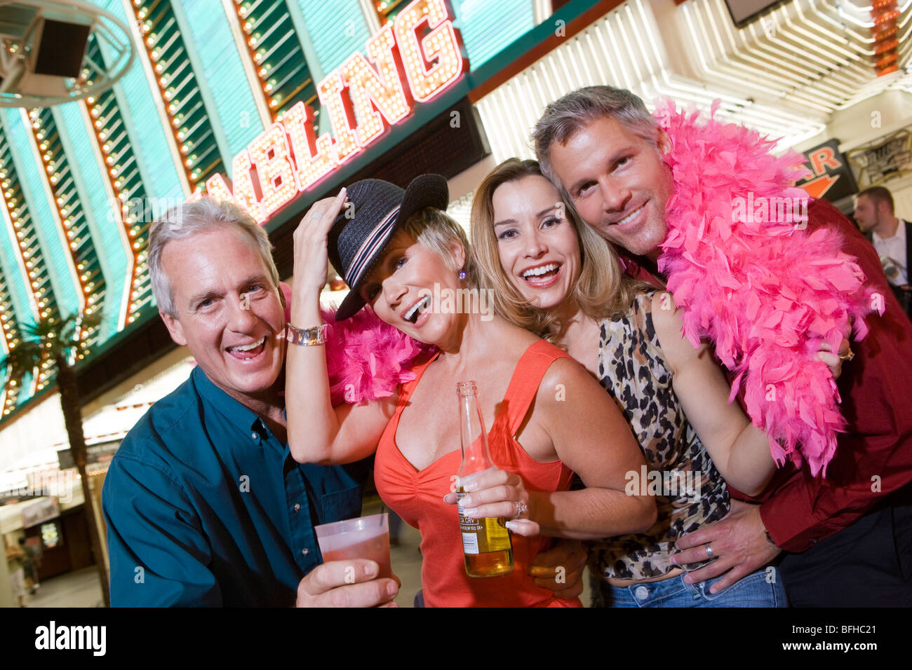 Two men and two women in front of casino building, portrait Stock Photo