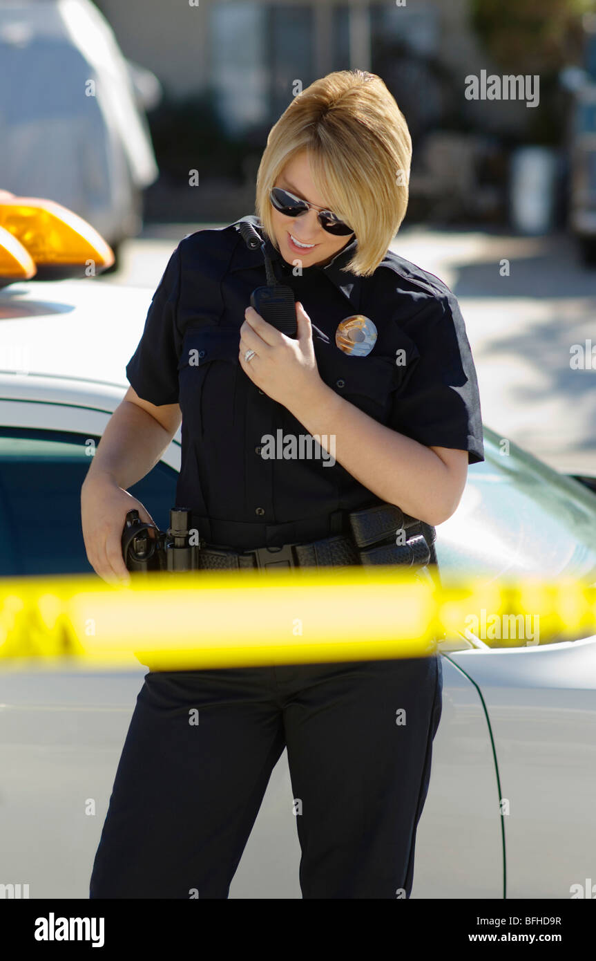 Police Officer Using Two-Way Radio Stock Photo