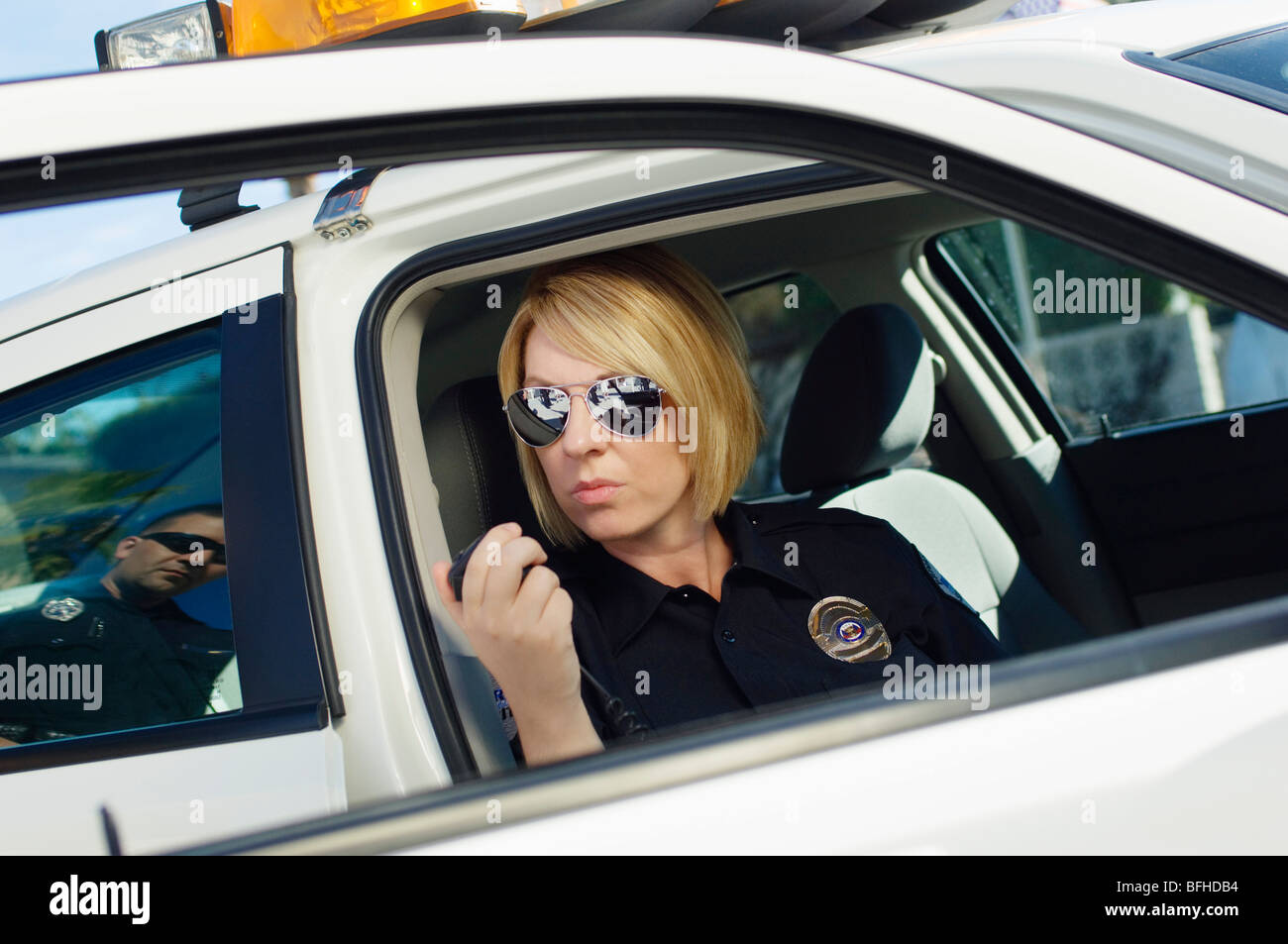 Police Officer Using Two-Way Radio Stock Photo