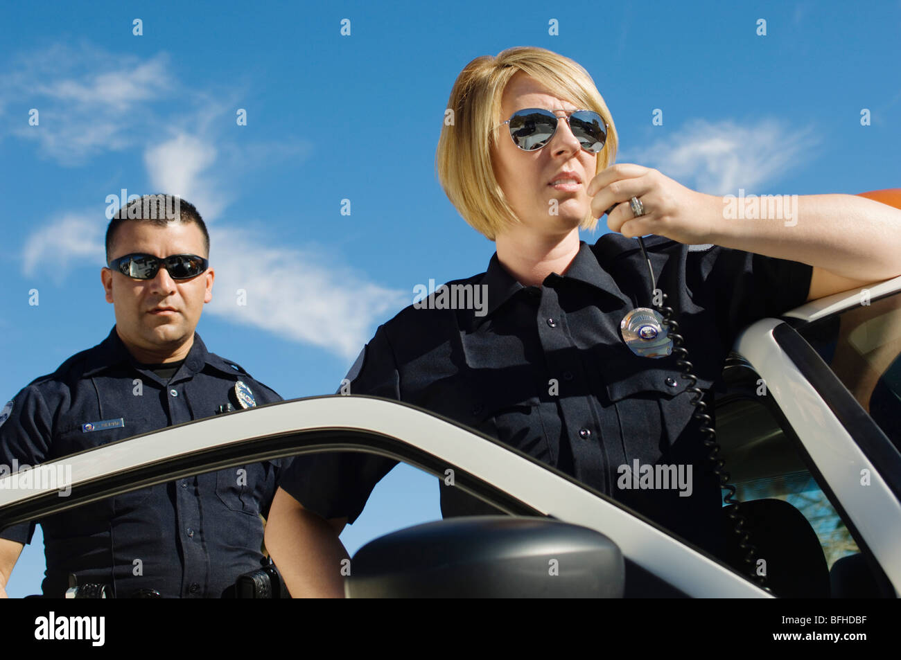 Police Officers Using Two-Way Radio Stock Photo