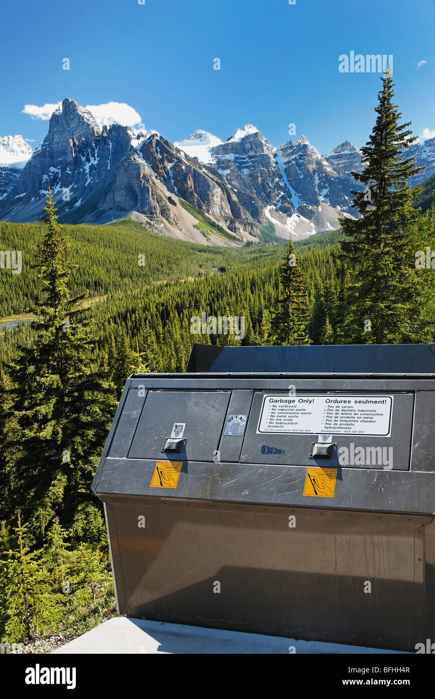 Garbage dumpster in the Forest beneath the slopes of The Valley of Ten Peaks in Banff National Park, Alberta Canada. Stock Photo