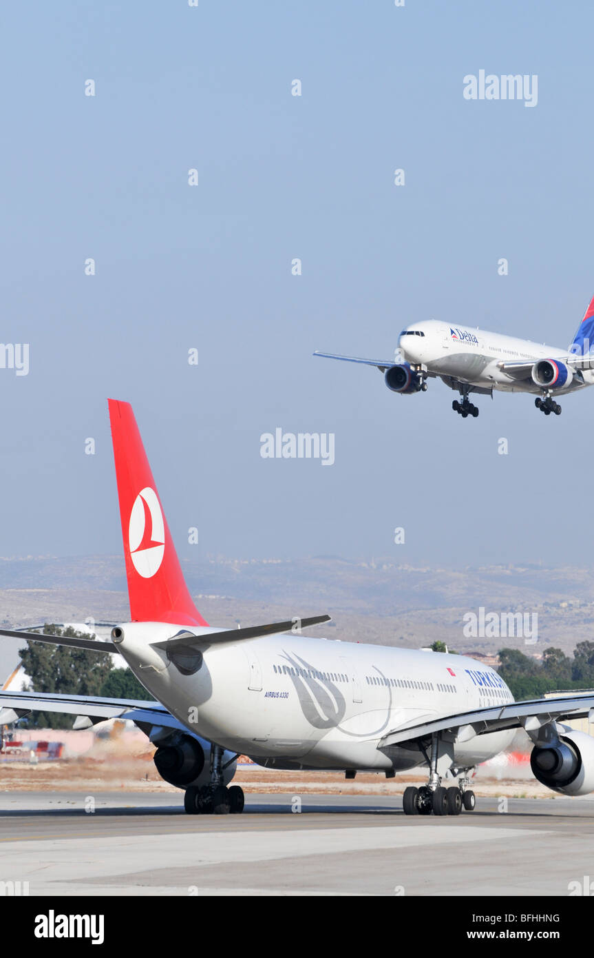 Israel, Ben-Gurion international Airport Turkish Airlines Airbus A330 waits for a Delta Airlines passenger jet to land Stock Photo