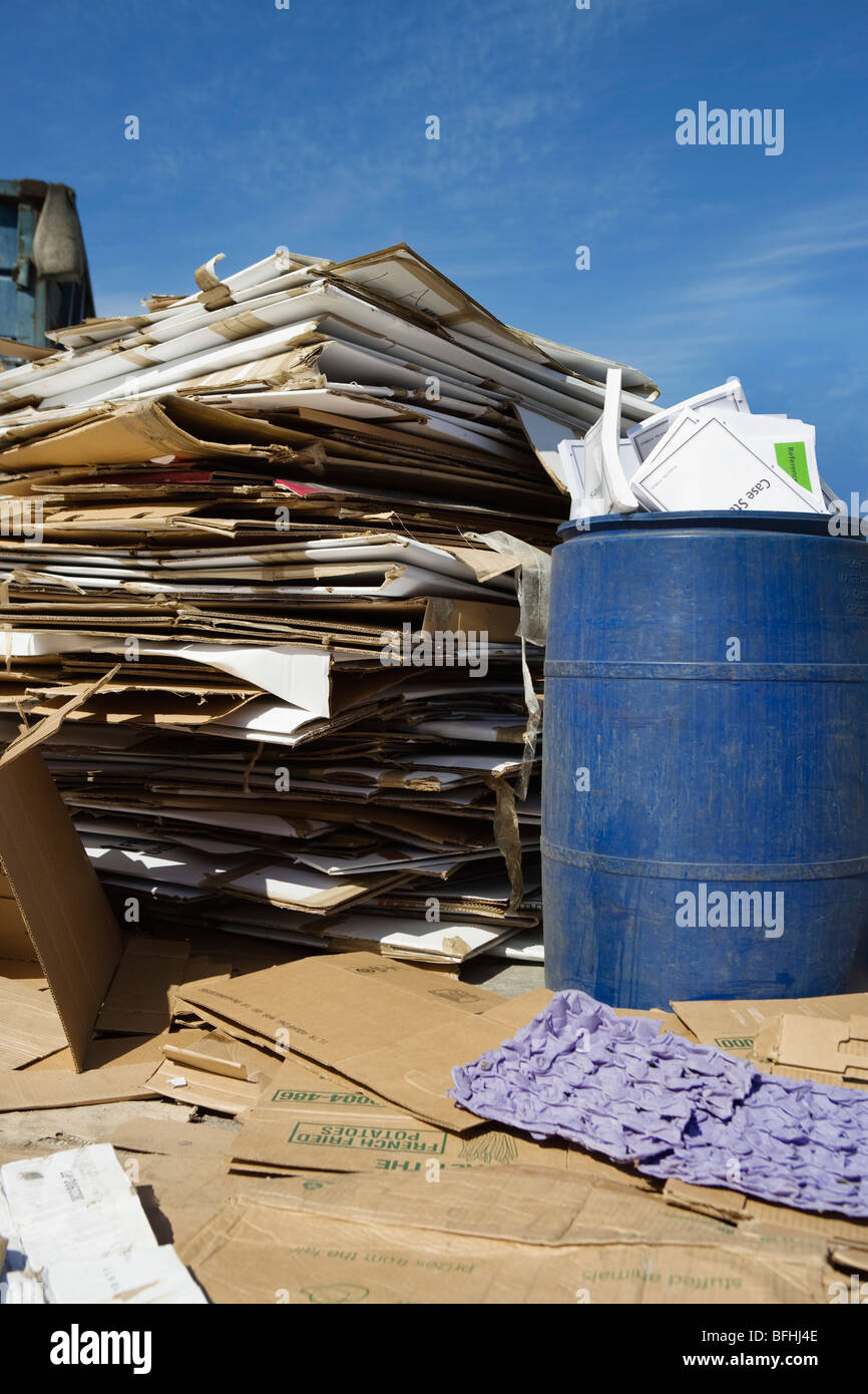 Stacks of cardboard boxes in recycling centre Stock Photo - Alamy