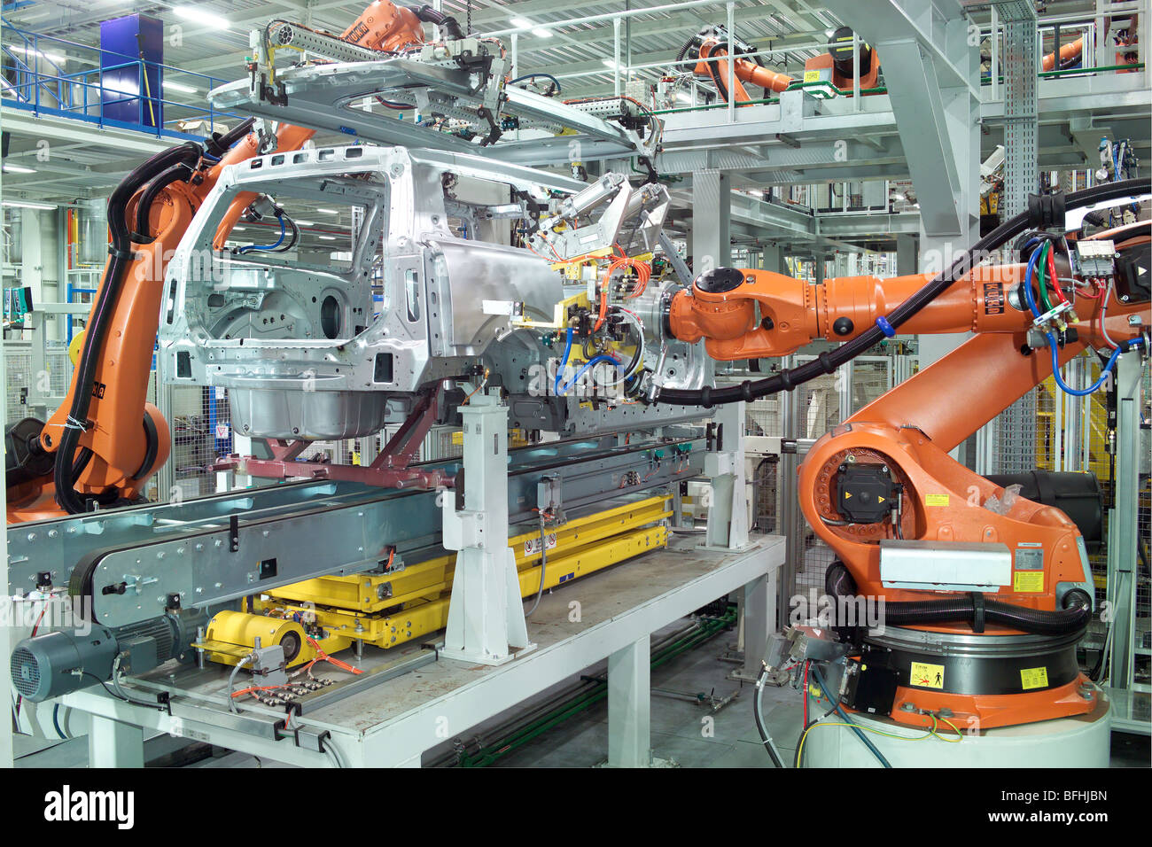 Robots spot welding in a car assembly plant Stock Photo