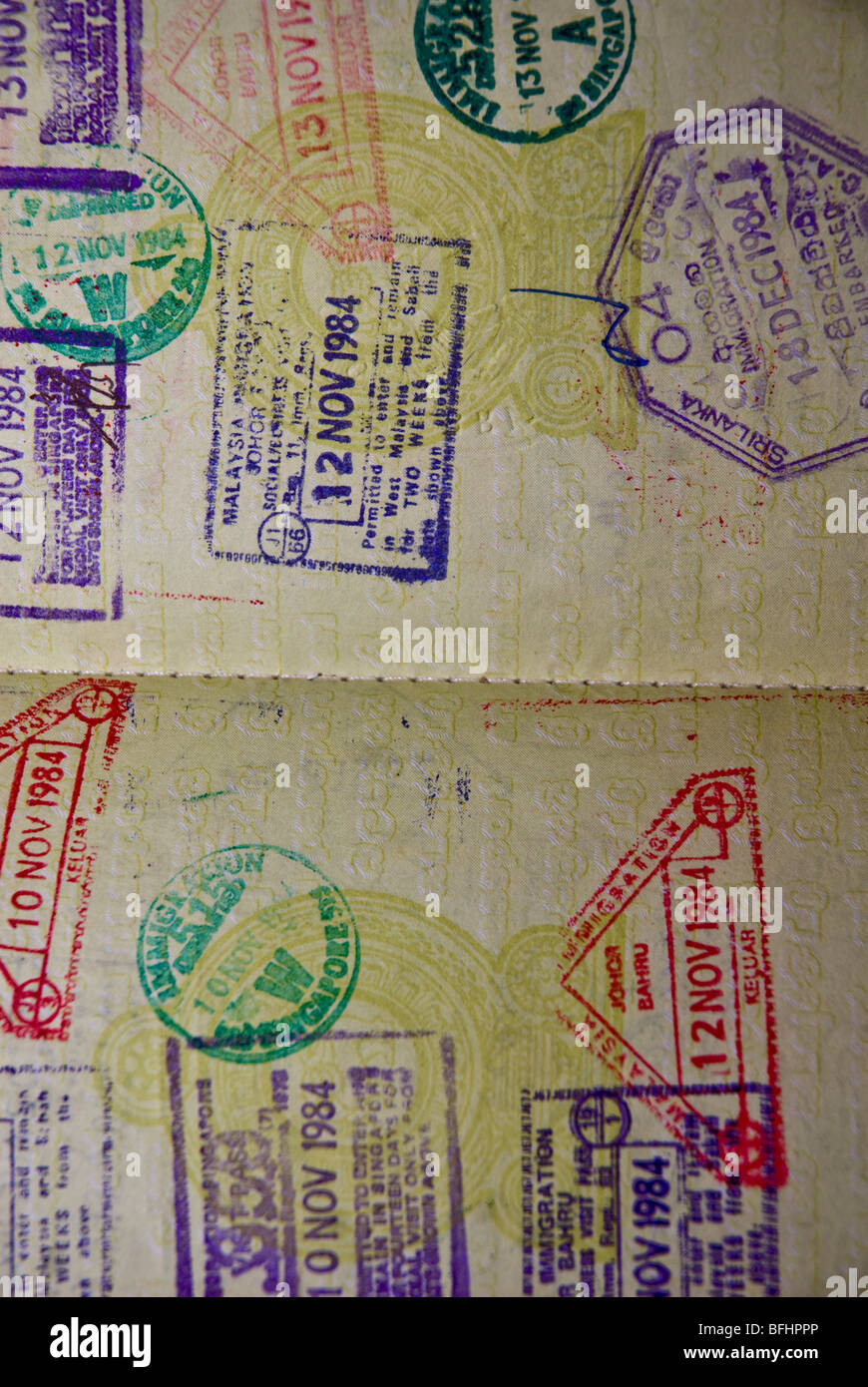 International immigration stamps and visas in a passport Stock Photo