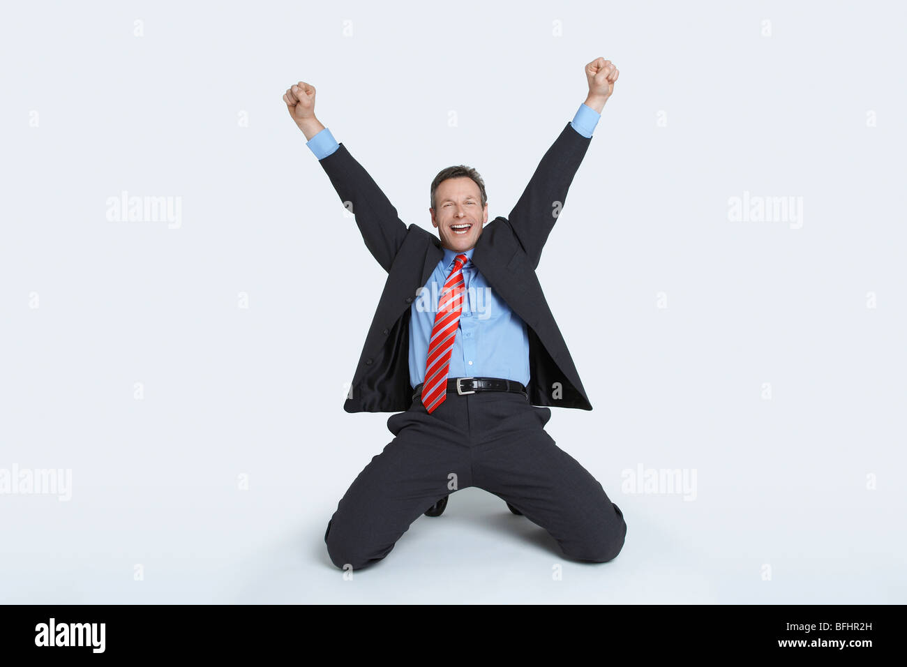 Man kneeling suit hi-res stock photography and images - Alamy