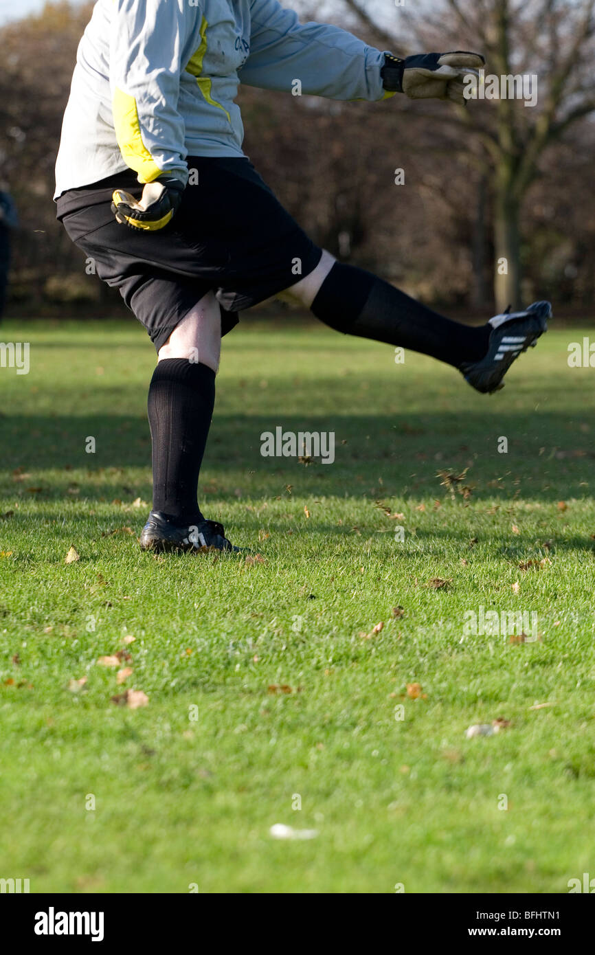 A goalkeeper kicking a football Stock Photo Alamy