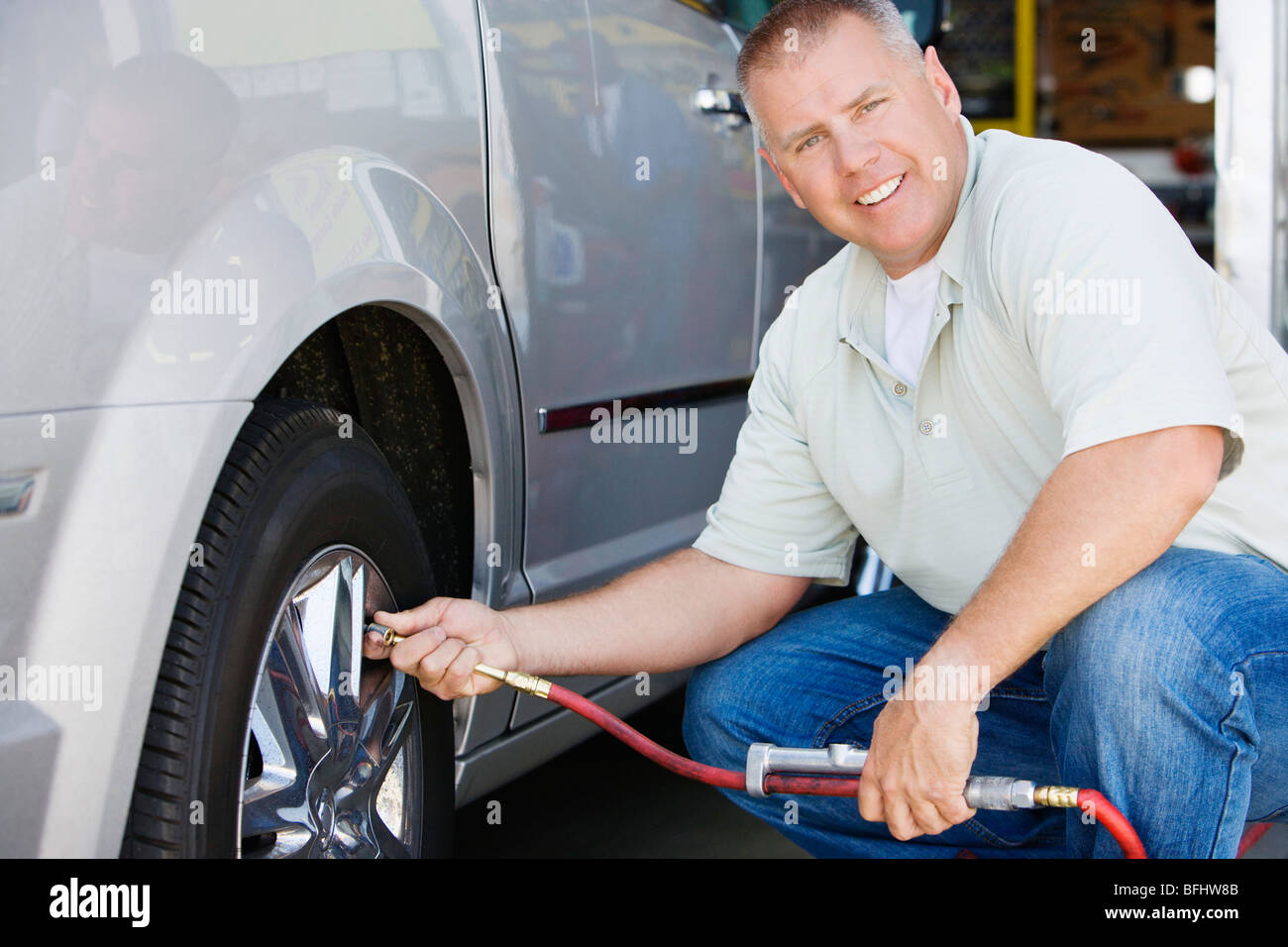 Man Filling Tires on RV Stock Photo Alamy