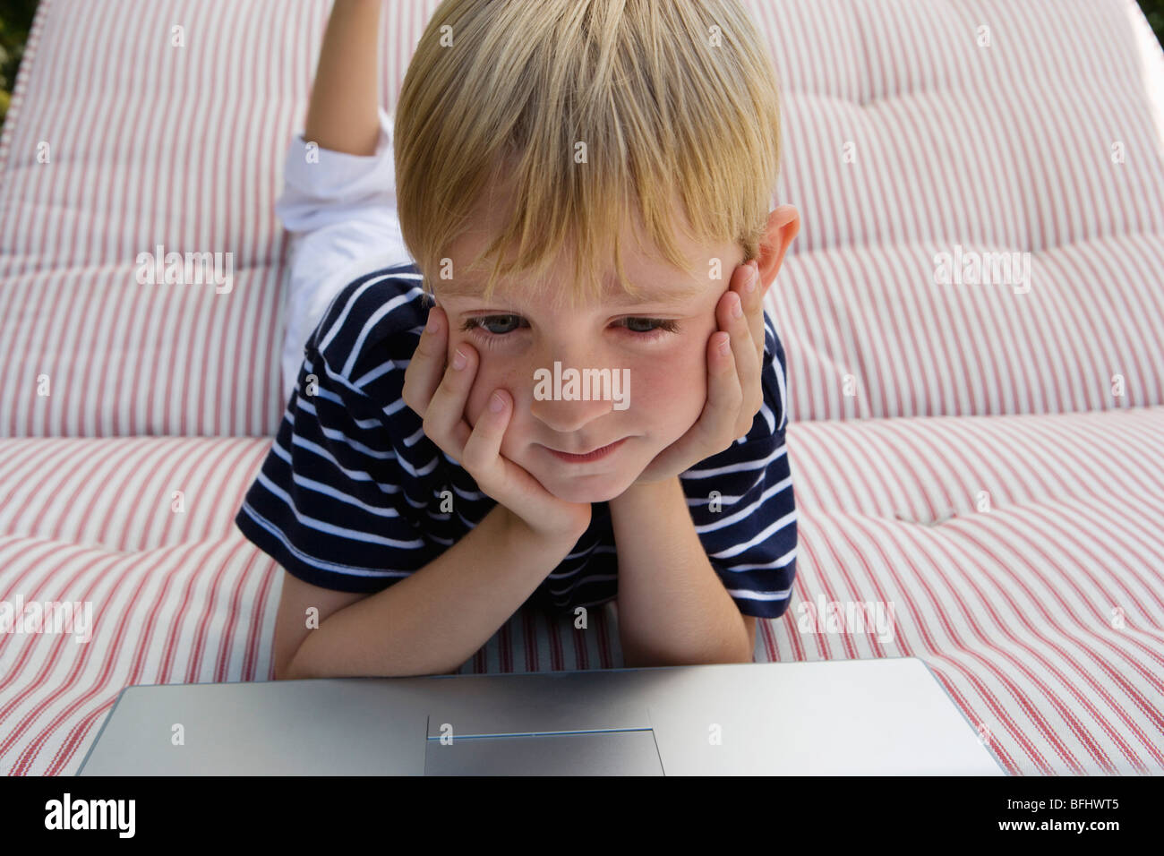 Little Boy Using a Laptop Stock Photo - Alamy