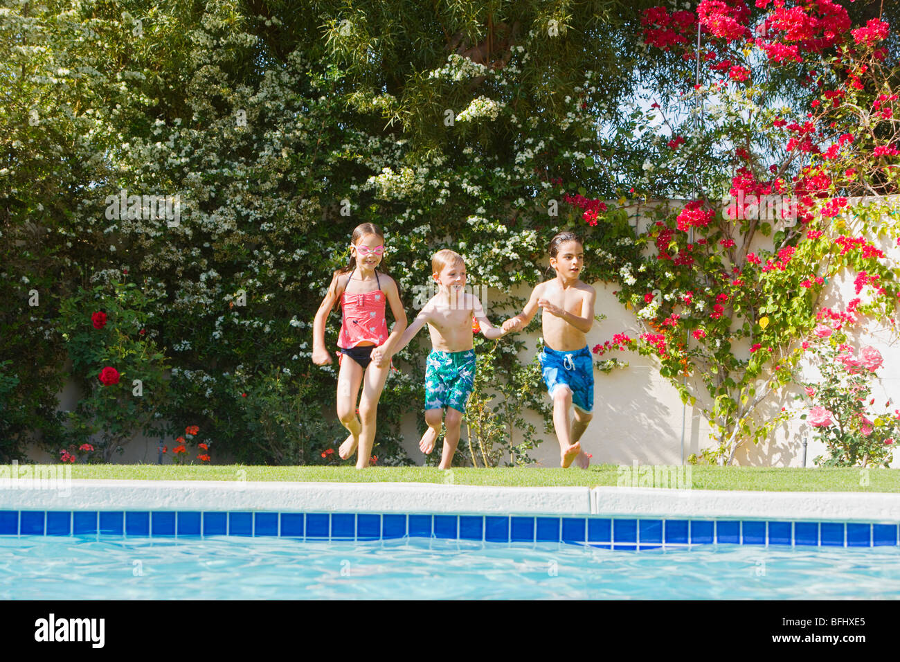 Kids Running Toward Swimming Pool Stock Photo Alamy