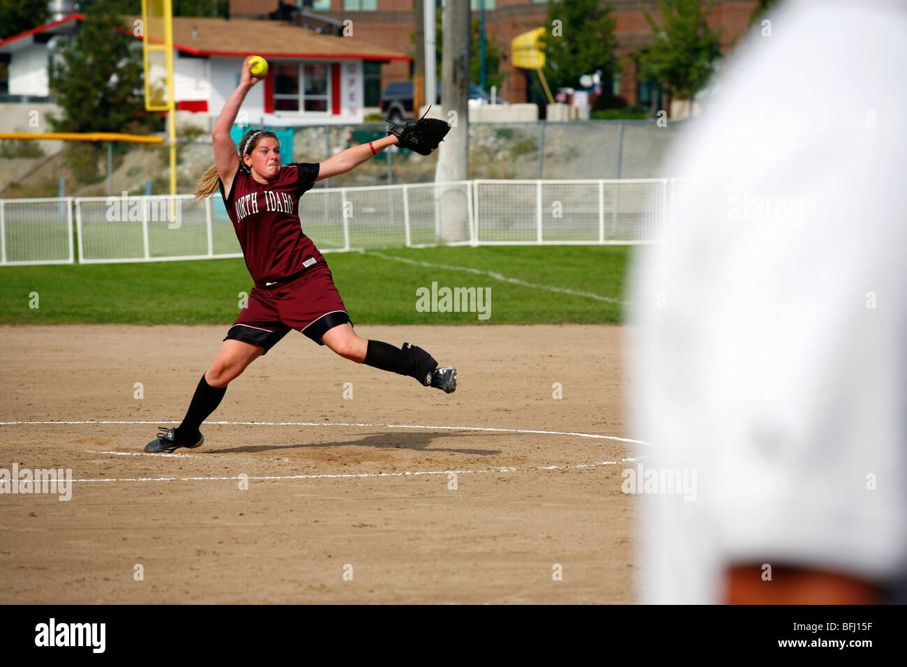 North Idaho College softball game, Sept. 28, 2008, Coeur D Alene, Idaho. Pitcher at the end of the wind-up. Stock Photo
