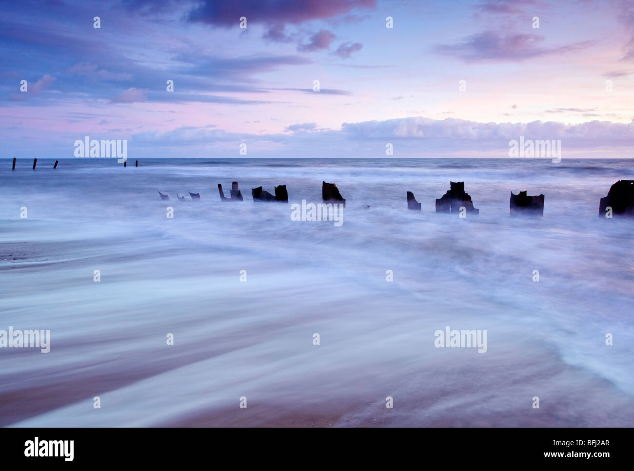 Derelict sea defences at first light at Happisburgh on the Norfolk