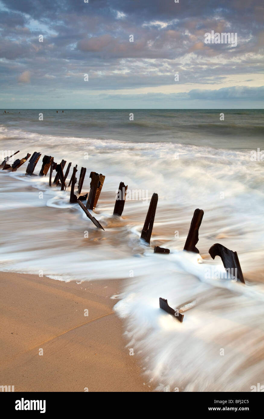 Derelict sea defences at first light at Happisburgh on the Norfolk
