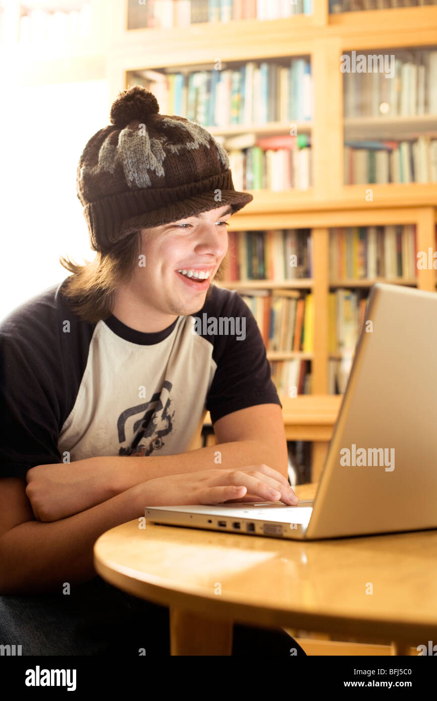 Teenage boy using a laptop, Sweden. Stock Photo