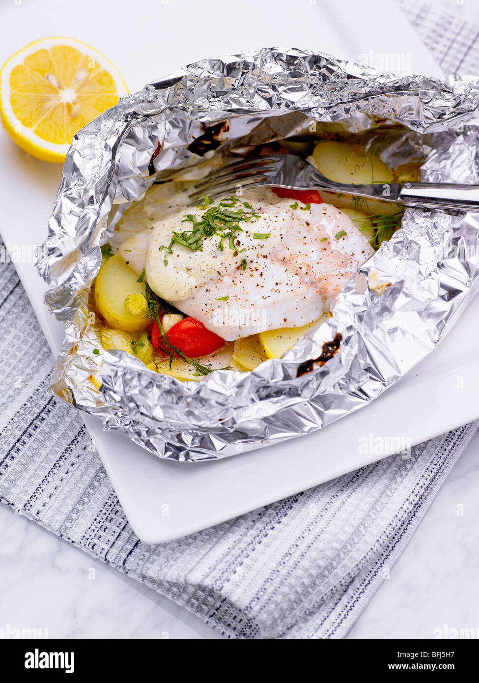 Fish in aluminum foil Stock Photo Alamy