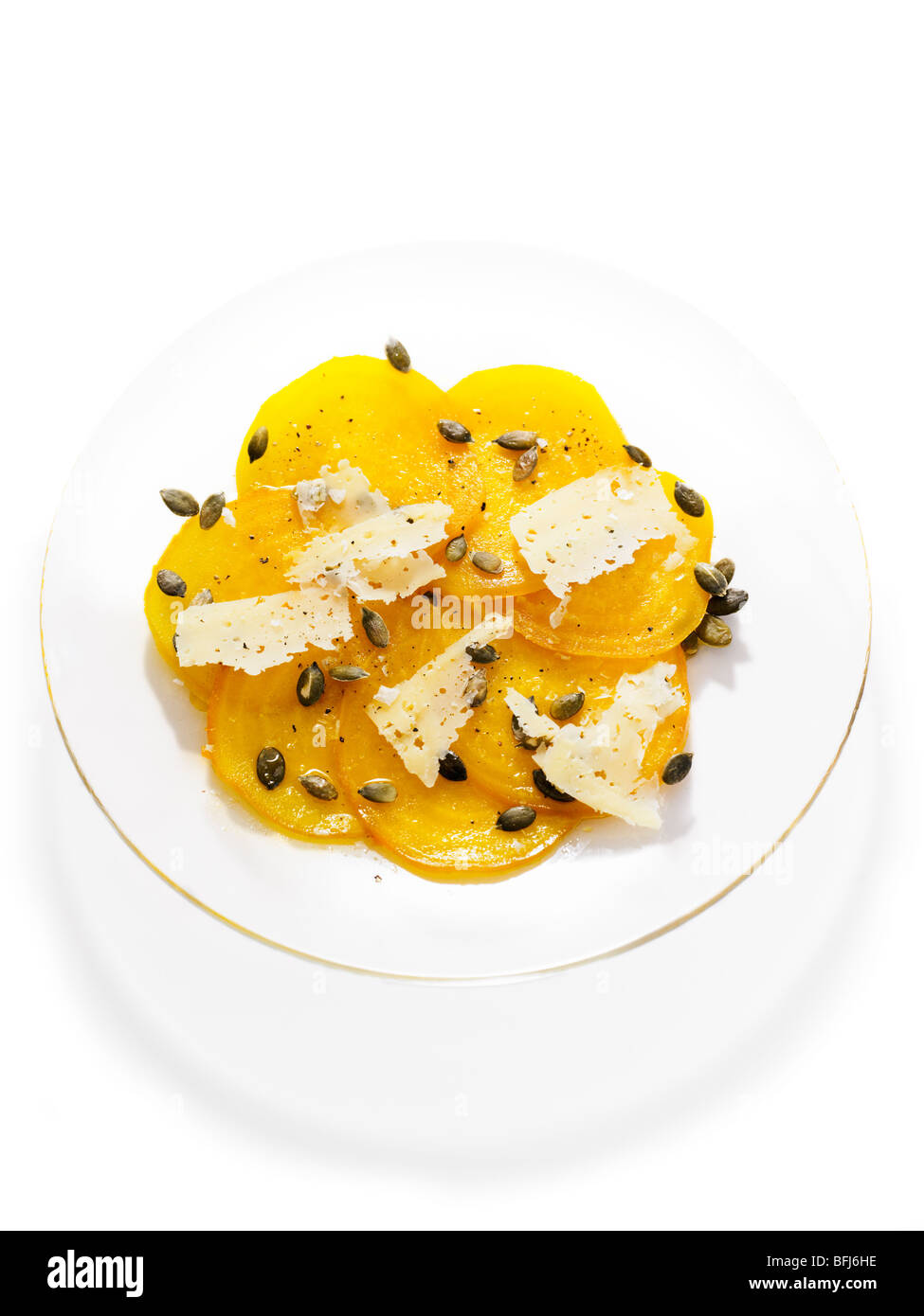 Yellow beet with seeds of pumpkin and slices of cheese, Sweden. Stock Photo