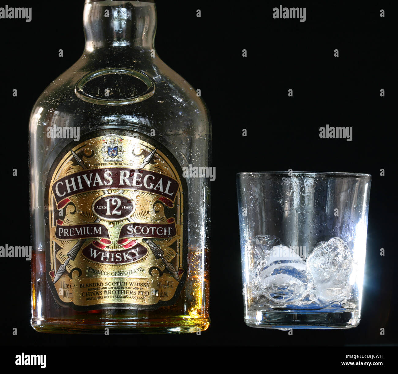 A bottle of Chivas Regal Whisky with a glass with ice cubes Stock Photo -  Alamy