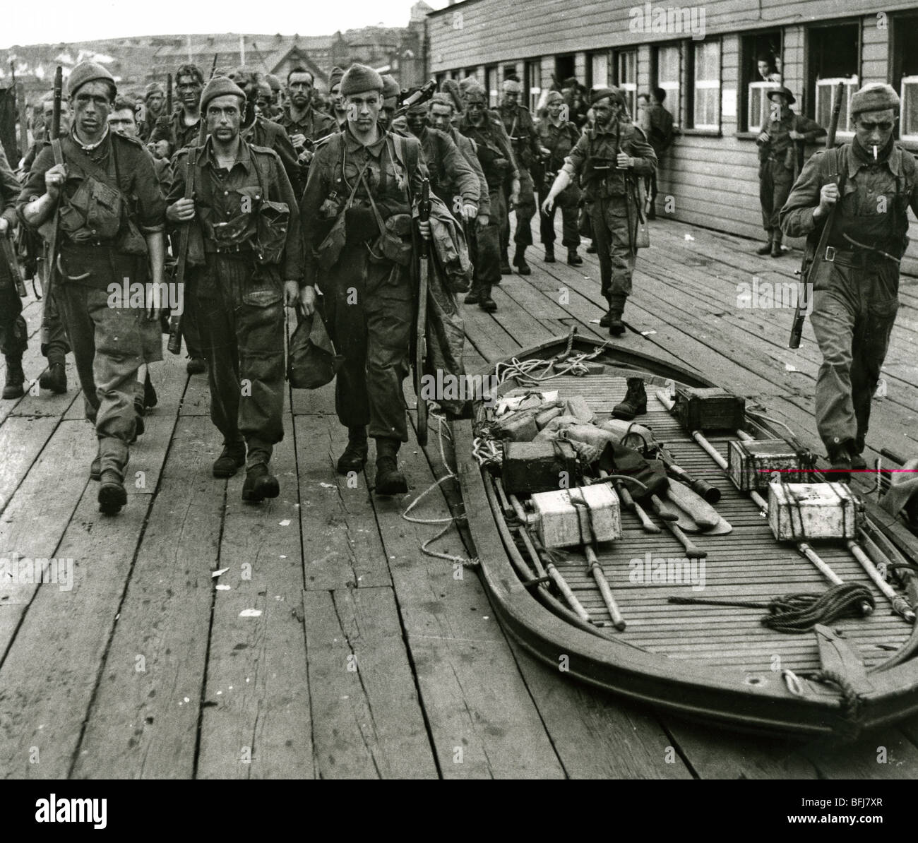 DIEPPE RAID  August 1942 - Exhausted Commandos arrive back at Newhaven after the raid. A collapsible boat is seen at right. Stock Photo