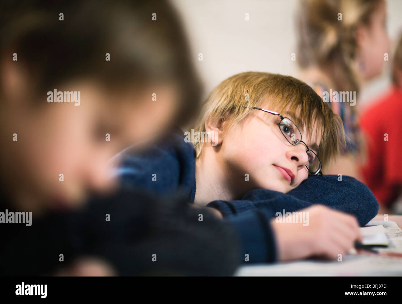 Boy daydreaming at school, Sweden. Stock Photo
