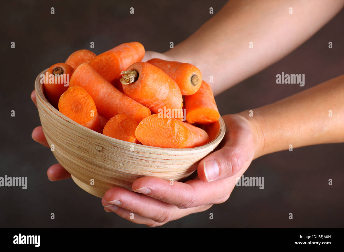 a bowl full of freshly prepared cut carrots Stock Photo