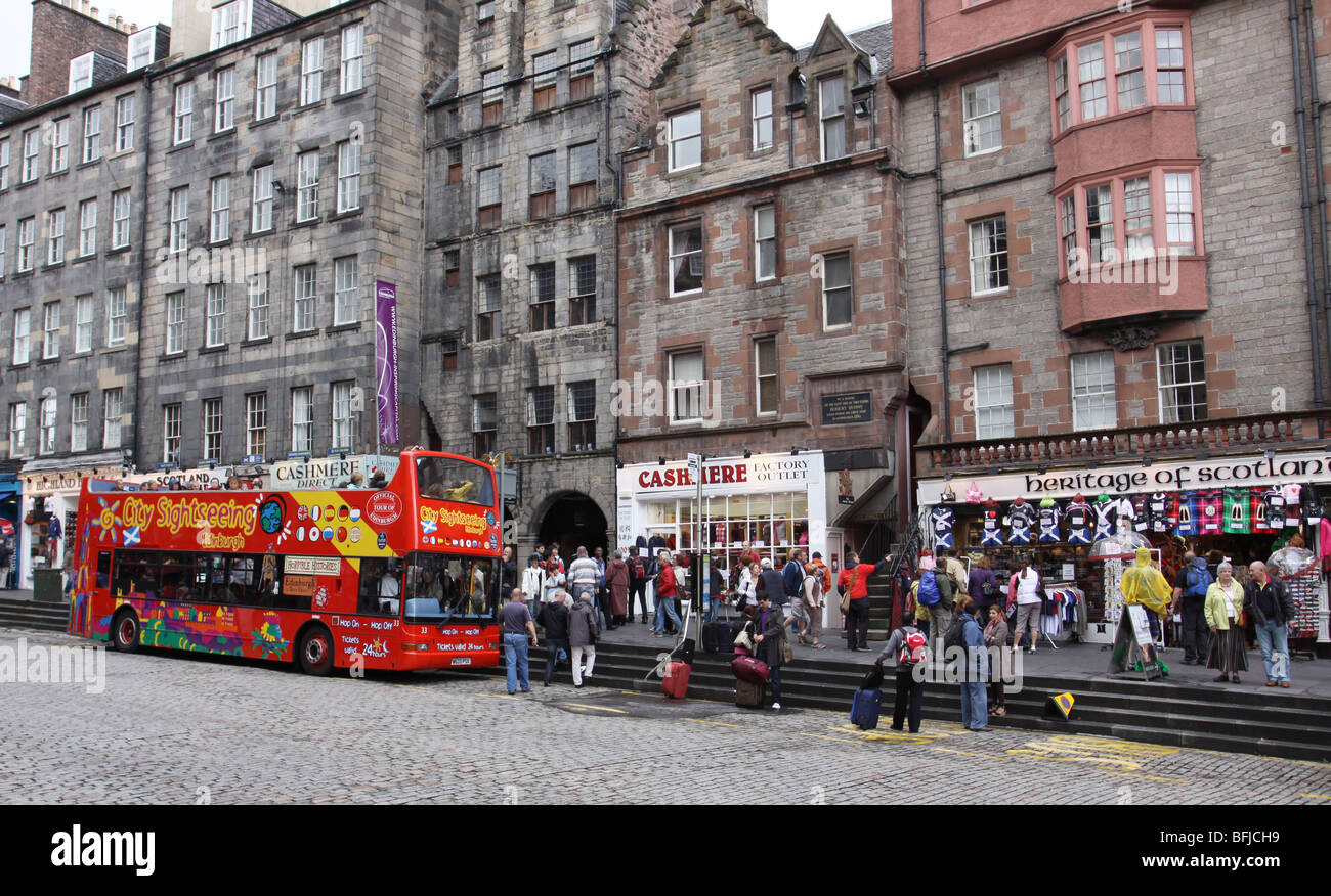 open top tour bus and souvenir shops on Royal Mile Edinburgh Scotland