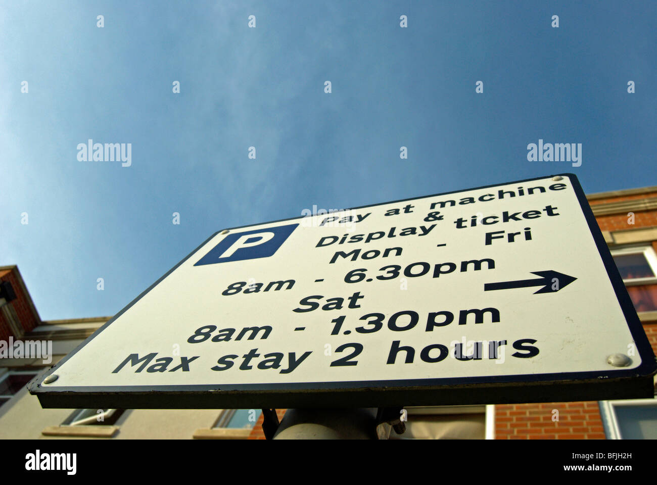 pay and display parking sign showing parking restrictions in barnes high street, barnes, southwest london, england Stock Photo