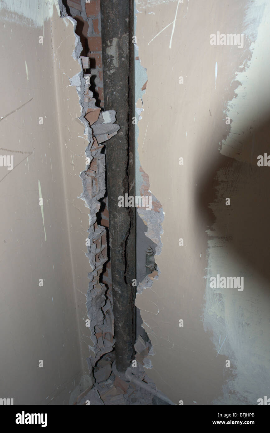 A vertical gutter in cast iron showing a deep crack Stock Photo Alamy