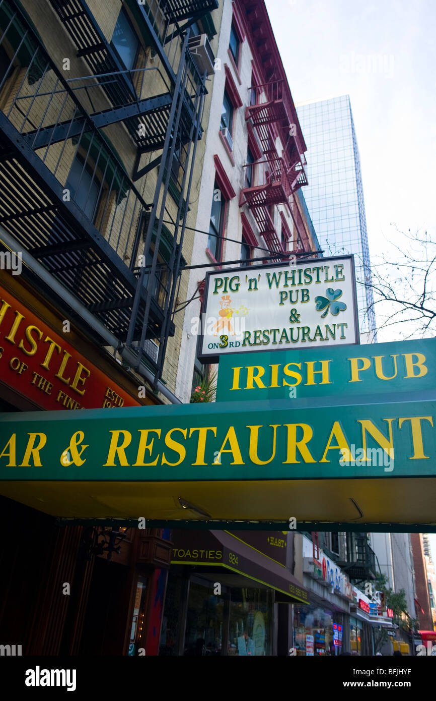 New York City , exterior signs of The Big Apple , Pig n Whistle Irish pub , bar & restaurant on
