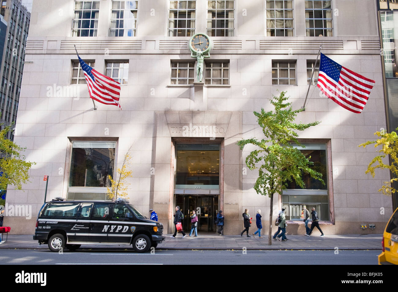 New York City , The Big Apple , The Tiffany & Co store or shop on 5th Avenue with American flags & NYPD traffic vehicle outside Stock Photo