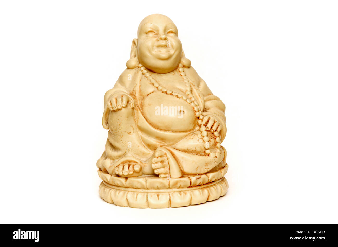 Smiling ivory Buddha on a white background Stock Photo