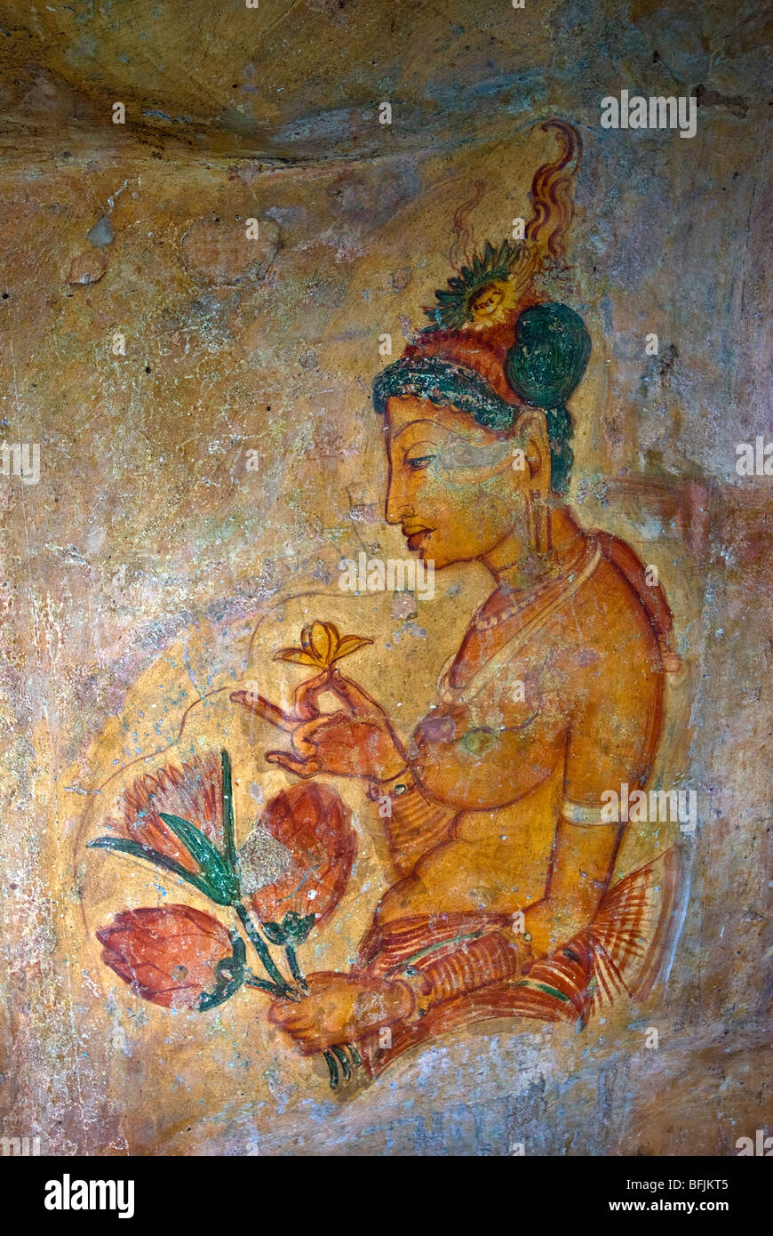 Ancient frescoes of maidens on cave wall at Sigiriya Rock Fortress, Sigiriya, Sri Lanka Stock Photo
