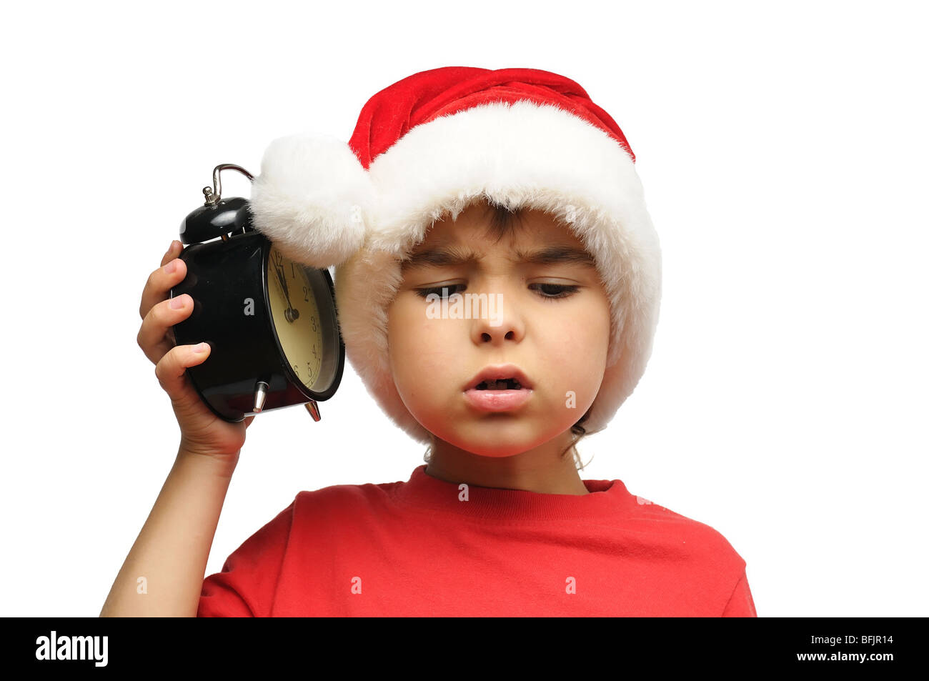 Santa kid holding an alarm clock Stock Photo