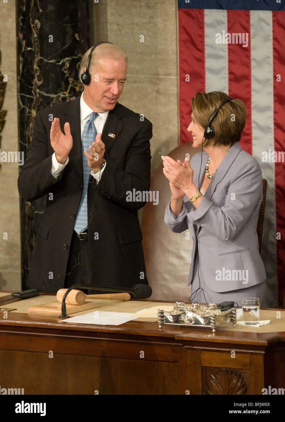 Vice President Joe Biden and House Speaker Nancy Pelosi speak during Angela Merkel's address to Congress. Stock Photo