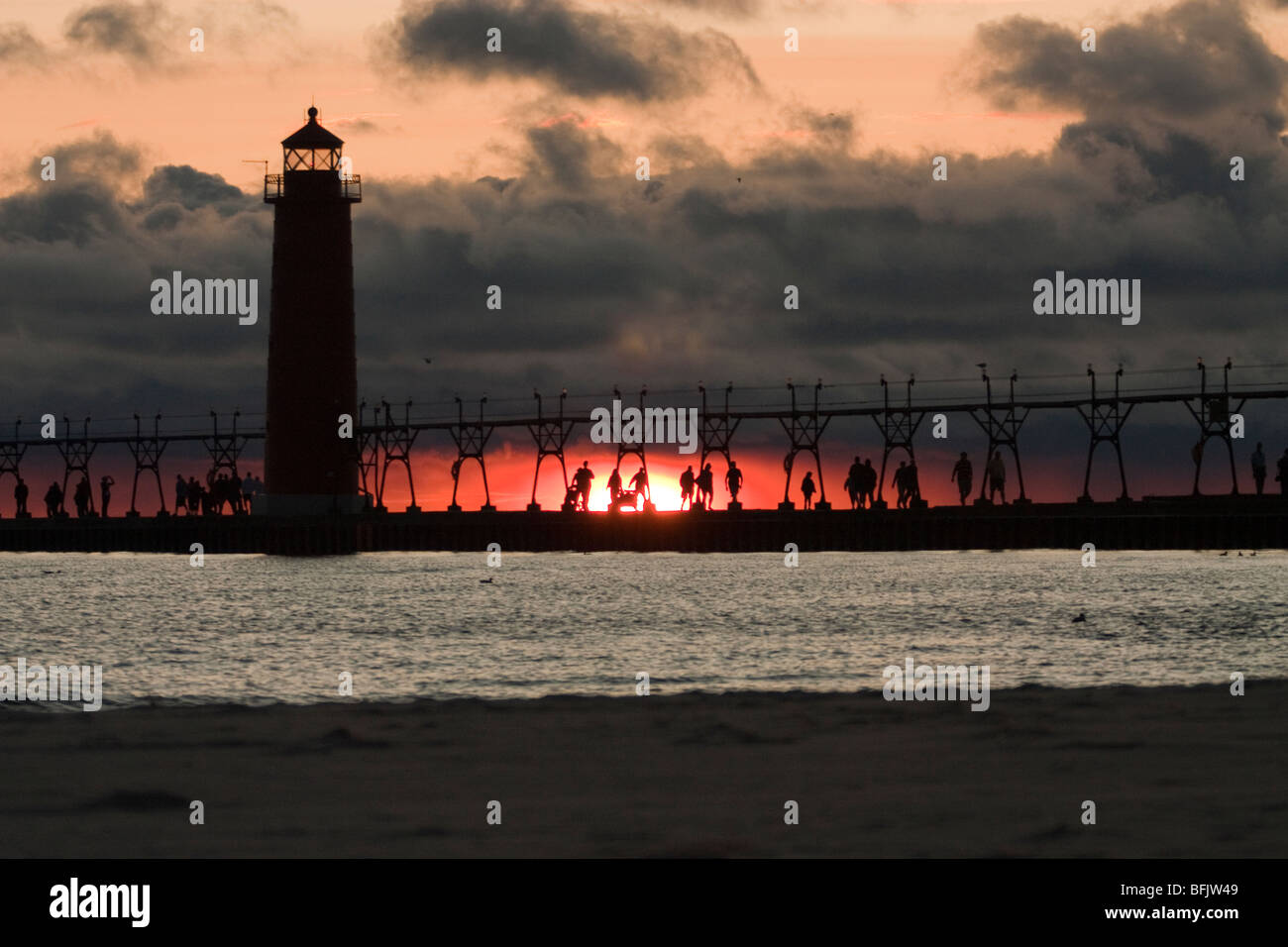 Lighthouse at sunset at Muskegon State Park Stock Photo