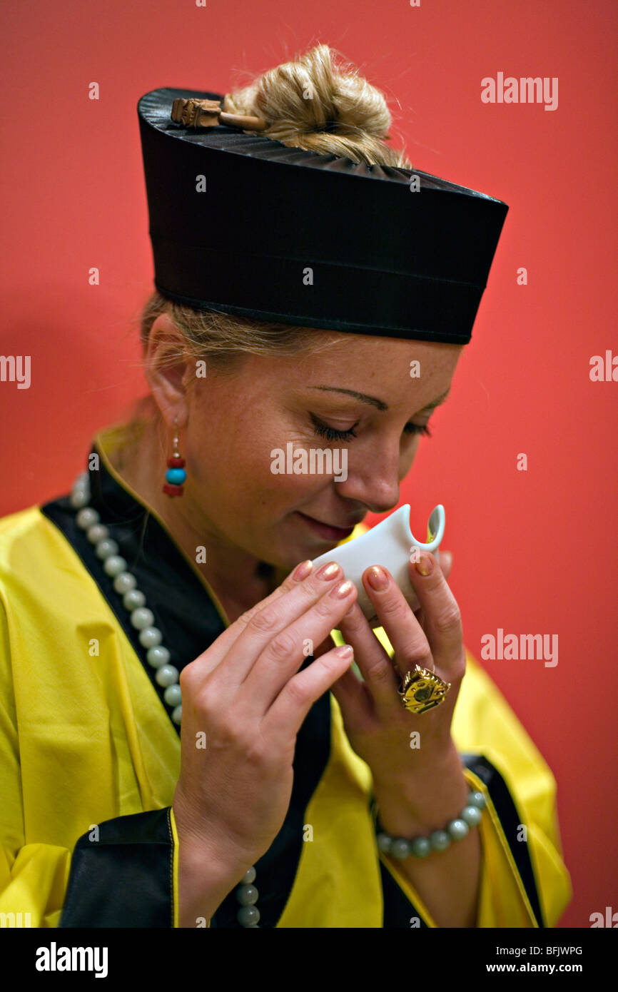 Caucasian woman performing Chineese tea ceremony Stock Photo