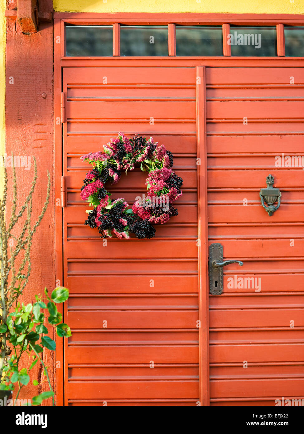 Flower garland on a door. Stock Photo