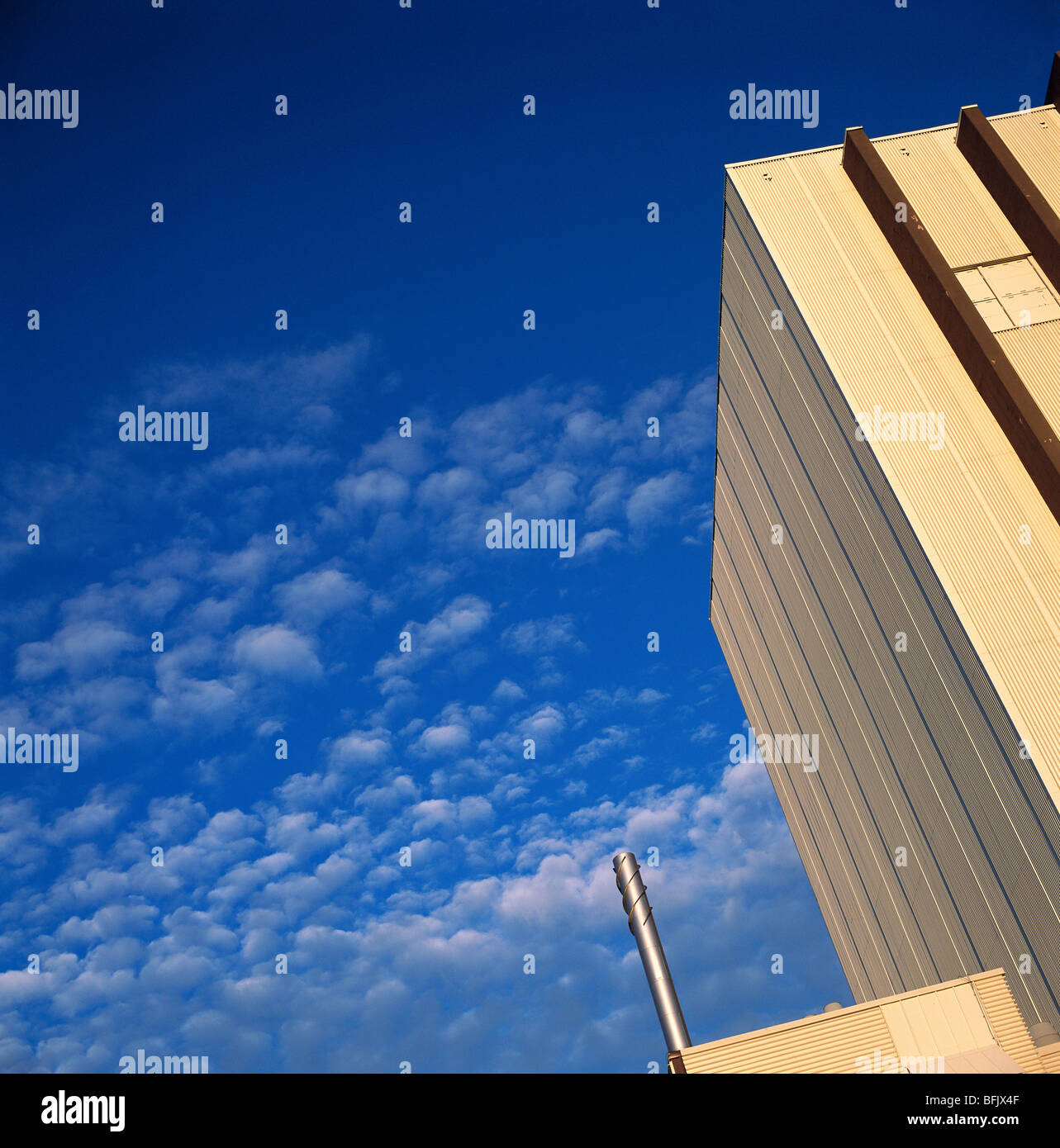 Industrial building and a blue sky. Stock Photo