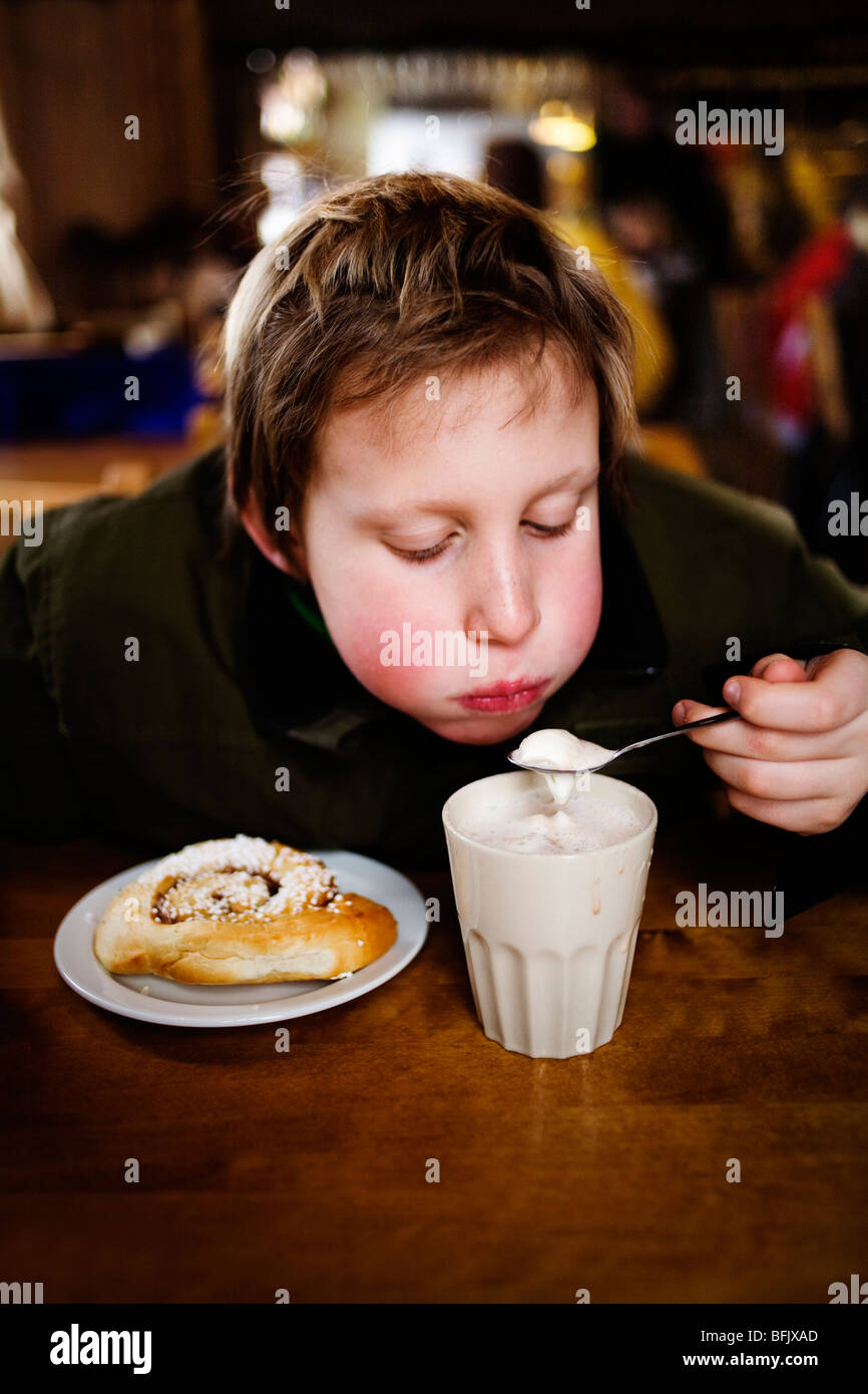 A boy drinking hot chocolate. Stock Photo